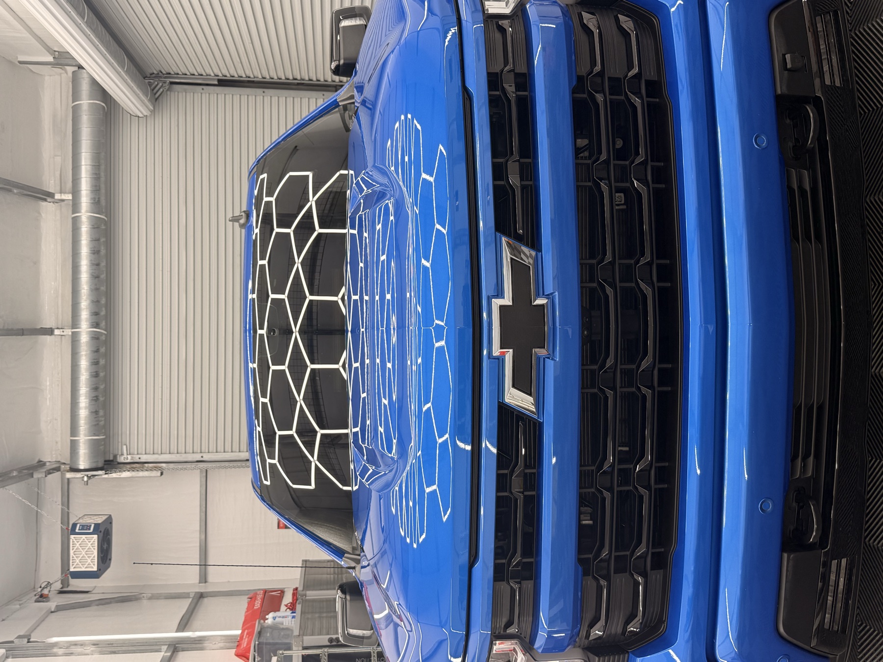 Ceramic-coated finish under the shop lights.
